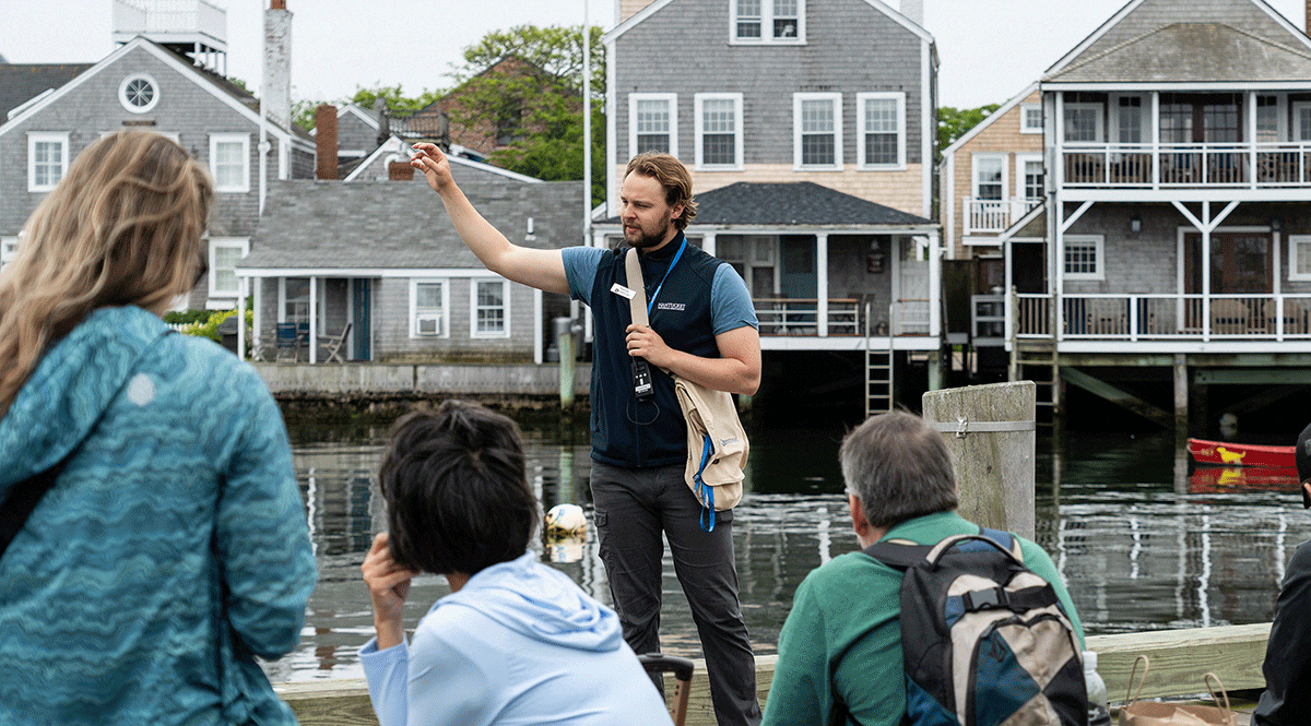 Nantucket Historical Association guide leading a walking tour along Nantucket’s historic waterfront.
